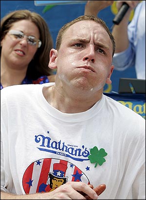 Joey Chestnut breaks the hot dog eating record. Why?