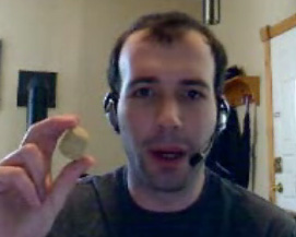 The Last Angry Young Man holding up a piece of monkey food.